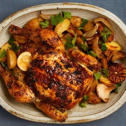 Roast chicken and rosemary potatoes with yoghurt gravy