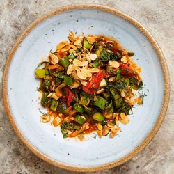 Tomato, chard and spinach with fried almonds