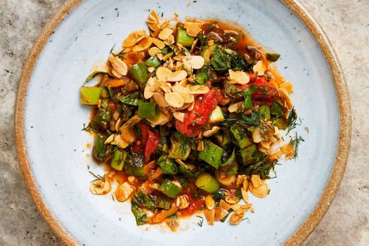 Tomato, chard and spinach with fried almonds